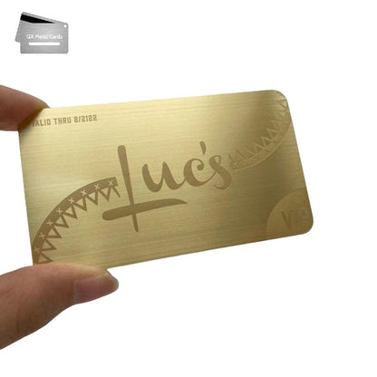 brushed gold metal membership cards